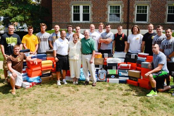 Football Team Begins Camp By Giving Back to the Community