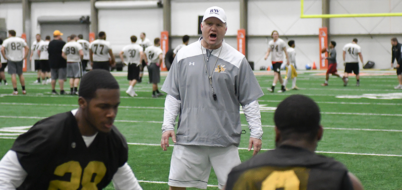 Head Coach Jim Hilvert  coaching up his players during a drill at the Cleveland Browns practice facility