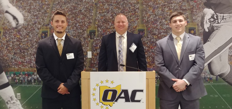 Senior wide receiver Rob Wolfington, head coach Jim Hilvert and senior defensive back Andrew Groves