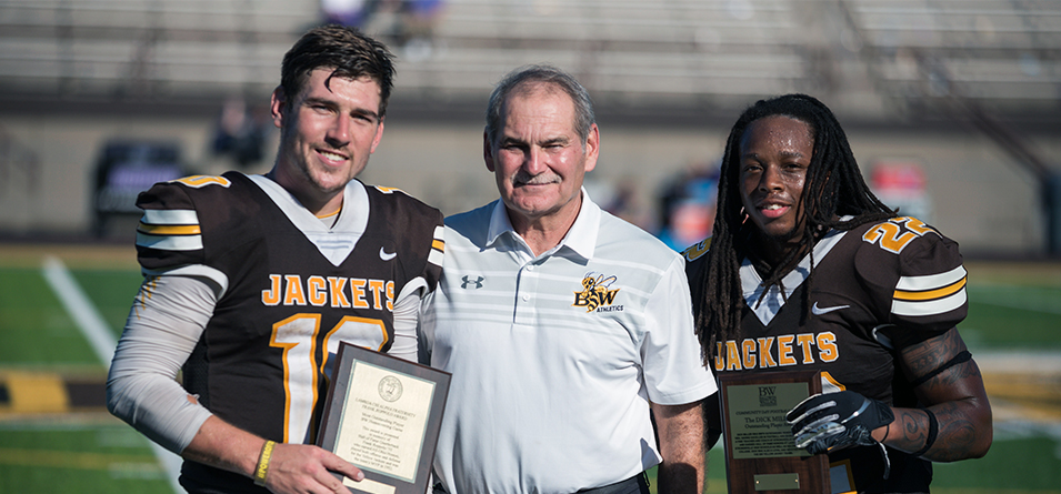 BW Frank Ropollo Offensive Player of the Game Jake Hudson, Director of Athletics Kris Diaz and Dick Miller Defensive Player of the Game Raheem Wilson (Photo Credit Jesse Kucewicz)