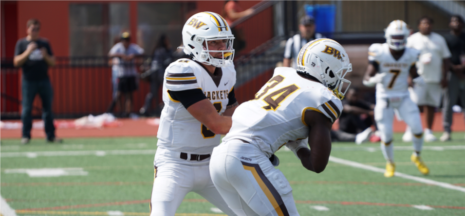 Keagan Armitage hands off to Jon Murray, Jr.