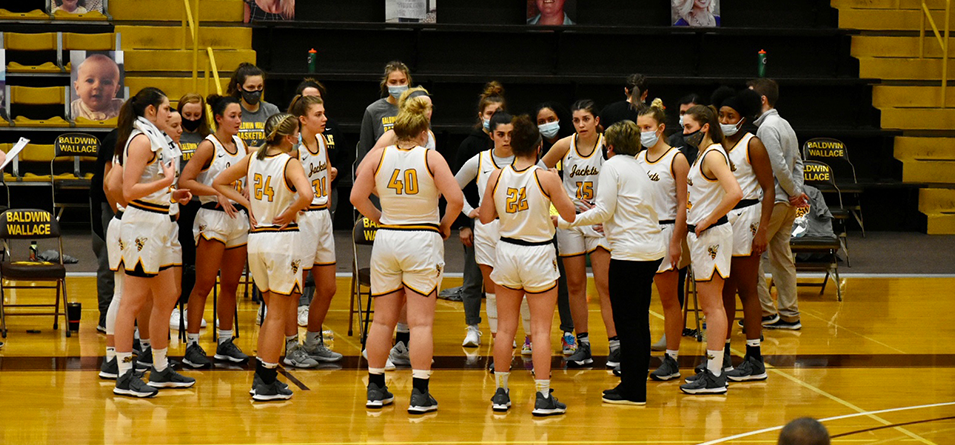 Head Coach Cheri Harrer Talks it Over in the Huddle (Photo Courtesy of Dustin Johnson '24)