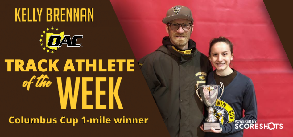 Assistant track coach Joe Eby and Kelly Brennan after winning the invitational 1-mile 